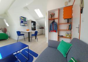 a living room with a couch and a table at Du Peps au coeur d'Angers ! in Angers +4 photos