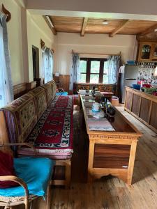 a living room with a couch and a table at Hotel Eco Friendly Pvt in Thāre Pāti