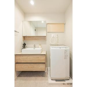 a bathroom with a sink and a refrigerator at Mi-Villa SHIBUYA HONMACHI in Tokyo +114 photos