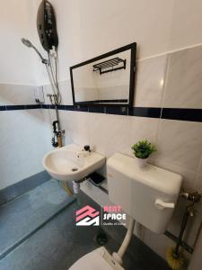 a bathroom with a toilet and a sink at Rent Space Coliving Bandar Hilir Melaka in Melaka