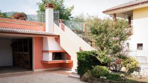 a house with a staircase in front of it at Sassimori casa vacanza in Chiampo