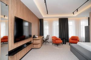 TV a/nebo společenská místnost v ubytování Rinvoks boutique hotel