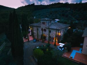 an aerial view of a large stone house with a yard at Terre di Baccio in Greve in Chianti