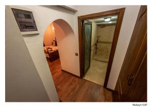 a hallway with a door leading to a bedroom at Kervansaray Antique Hotel in Cesme +49 photos