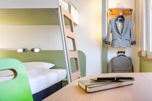 Postel nebo postele na pokoji v ubytování ibis budget Metz Sud
