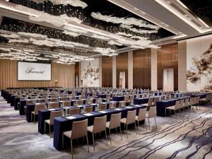a large room with rows of chairs and a screen at Fairmont Chengdu in Chengdu +169 photos