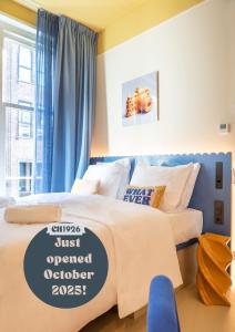 a bedroom with two beds with a sign that says just opened at City Hotel Rembrandt Square - Just renovated in Amsterdam