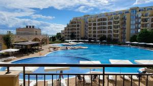 a large swimming pool next to a large building at Studio F210 - Bulharsko in Aheloy