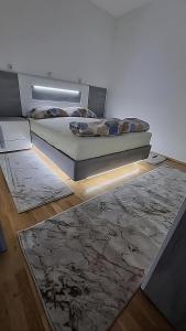 Postel nebo postele na pokoji v ubytování Visoko Prime Residence
