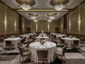 a banquet room with tables and chairs and chandeliers at Fairmont Century Plaza Los Angeles at Beverly Hills in Los Angeles +181 photos
