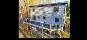 an aerial view of a house with a porch at Hidden gem at the lake 4 bedrooms in Moneta
