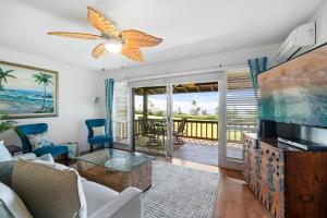 a living room with a view of the ocean at Kaanapali Plantation 10 · KPL 10 Panoramic Ocean Views 2BD near in Lahaina