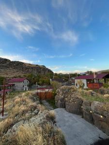 a view of a town with houses and some rocks at River Home Villa in Kʼaghsi