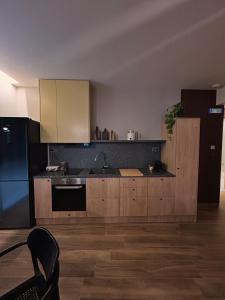 a kitchen with a sink and a stove at City Core Katerini, Platea Lux in Katerini +1 photo