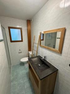 a bathroom with a sink and a toilet at Joli appartement cozy in Mercury