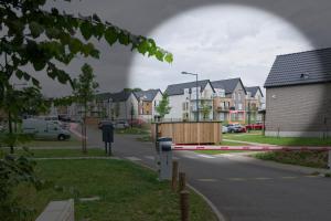 a street with some houses and a barricade on the road at Sarananda - apartment in Saint-Valery-sur-Somme +7 photos