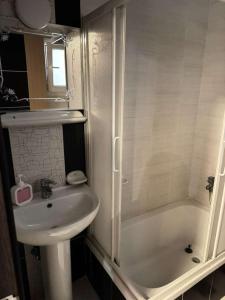 a bathroom with a sink and a toilet and a shower at Paradise residence in Dumyāţ al Jadīdah