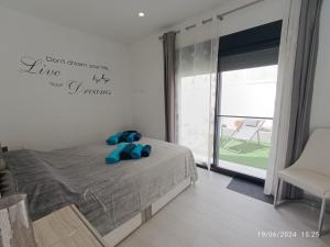 a bedroom with a bed with blue teddy bears on it at Casa Kempie in San Javier