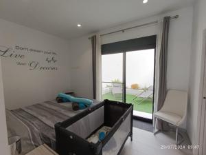 a bedroom with a bed with a sign that reads dont dream youre like your at Casa Kempie in San Javier +21 photos