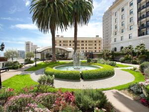 a fountain in a garden in front of a building at Fairmont San Francisco in San Francisco
