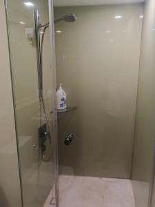 a shower with a glass door in a bathroom at Vortex suites klcc by city view kulal Lumpur in Kuala Lumpur +25 photos