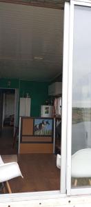 a view of a living room with a tv at Casa Campo in Cufré +14 photos