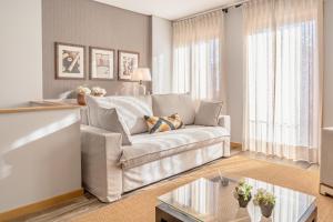 a living room with a couch and a table at LR Vintage 86 in Vila Real