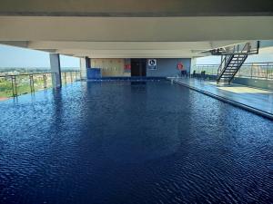 a large pool of water in a building at Comfort Suite in Miri in Miri