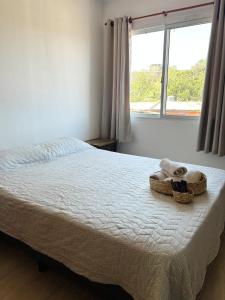 Ένα ή περισσότερα κρεβάτια σε δωμάτιο στο Departamento Centrico Iguazú 2C