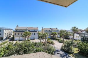 a view from the balcony of a building with palm trees at Madelyn's Oceanview in Tybee Island