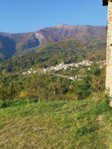 a view of a small town in the mountains at Rifugio Ca' da Cardella in Mendatica