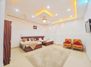 Ένα ή περισσότερα κρεβάτια σε δωμάτιο στο Hotel Jayaditya Palace Near Ram Mandir