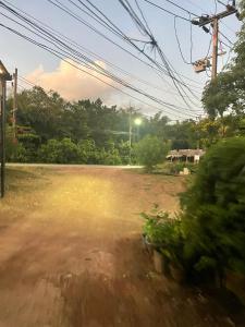 a view of a dirt road from a train window at Vannana House Ko Lanta in Ko Lanta