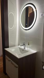 a bathroom with a sink and a mirror at DreamerLux in Loznica