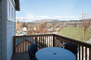 a blue table and chairs on a balcony at Private Reserve 30 day minimum in Hood River