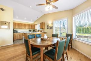 a kitchen and dining room with a wooden table and chairs at River Ranch in Hood River
