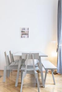 a table and two chairs in a living room at Central Cosy Stylish Apartment in Vienna +50 photos