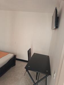 TV a/nebo společenská místnost v ubytování Hotel Confort Boutique