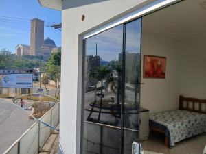 a balcony with a view of a city at Sobrado Mãezinha Aparecida in Aparecida