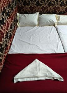 Ένα ή περισσότερα κρεβάτια σε δωμάτιο στο Kanthalloor Mud & Mist Homestay