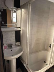 a bathroom with a sink and a toilet and a shower at Paradise residence in Dumyāţ al Jadīdah