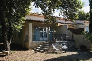 a building with stairs and a sign that reads pala maza at Gite Pellerin in Montbrison-sur-Lez