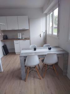 a kitchen with a large table and two chairs at appartement Poitiers in Poitiers
