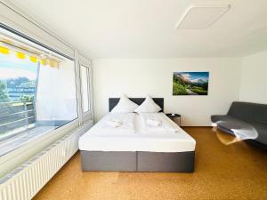 Postel nebo postele na pokoji v ubytování JJ Living - Bergzeit 160