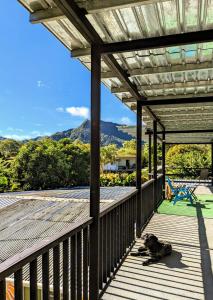 a dog laying on the deck of a house at MejorClub in Valle de Anton