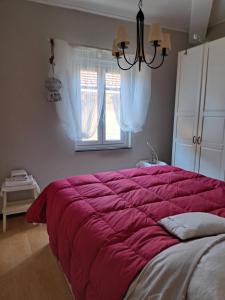 Postel nebo postele na pokoji v ubytování Appartamento San Quirico