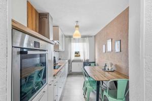 Kuchyň nebo kuchyňský kout v ubytování Modernes City Apartment mit Aussicht und WLAN