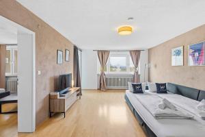 TV a/nebo společenská místnost v ubytování Modernes City Apartment mit Aussicht und WLAN
