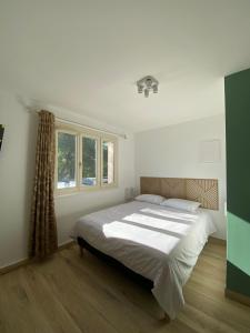 Postel nebo postele na pokoji v ubytování Les studios du village VIRIAT