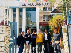 a group of people standing in front of a building at Alobar1000 Hostel in Kathmandu